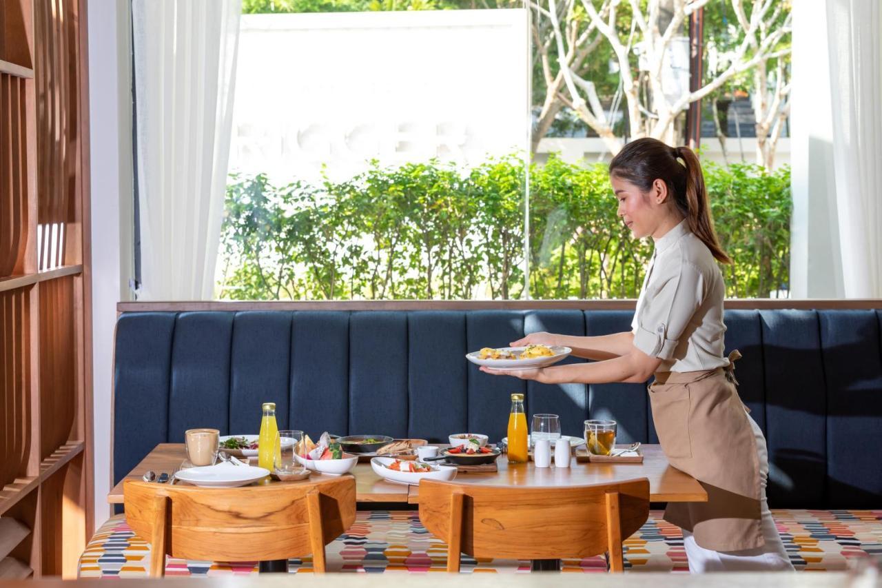 Outrigger Surin Beach Resort - Sha Extra Plus Exteriér fotografie A Thai waitress serving food